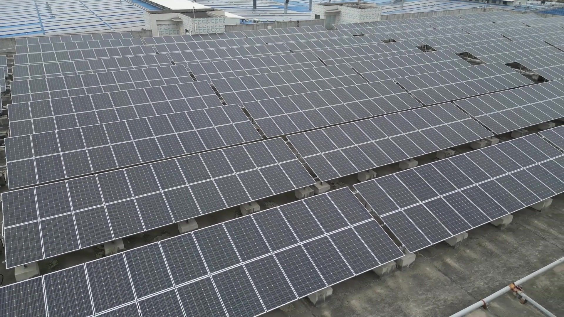 Rooftop solar panel array installed on an industrial building